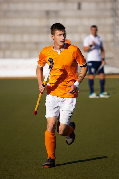 Field hockey player training and practicing the sport on grass