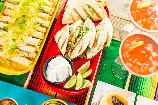 Fiesta party buffet table with traditional Mexican food.