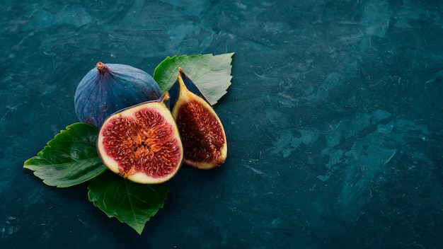 Fig Fresh fruit figs on a stone black table Free space for text Top view