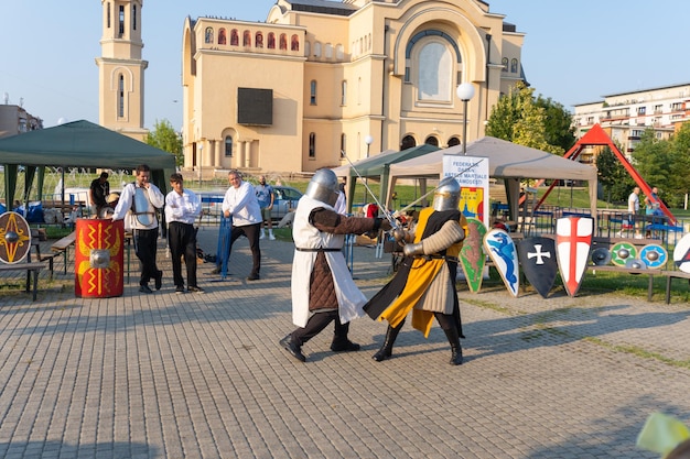 Fight demonstration with medieval suits knights in combat costume demonstration