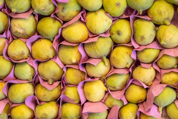 Figs on the market counter Pile of ripe figs