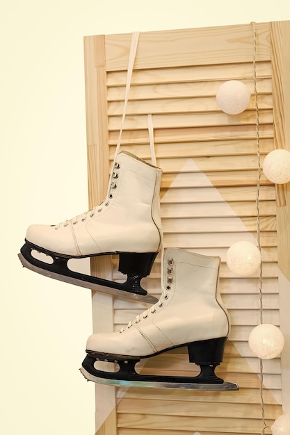 Figure skates on wooden door isolated