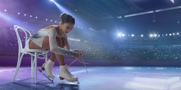 Figure skating girl in ice arena