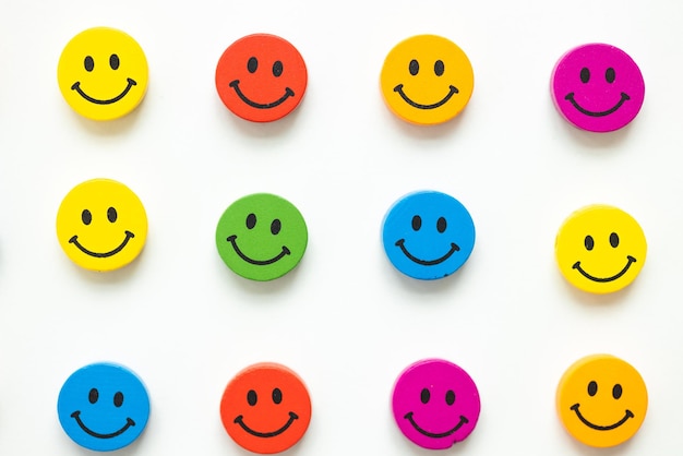 Figures in the form of colored smiles on a white background