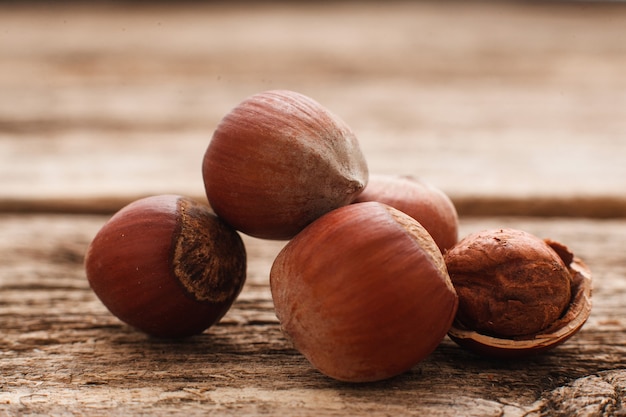 Filbert nuts on wood close-up