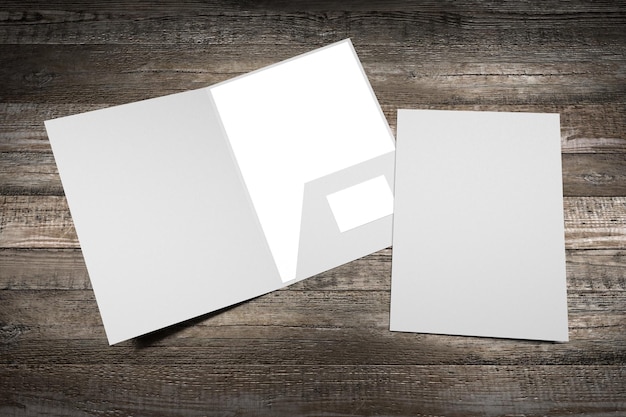 File folder mockup showing front cover and content pages on wooden background