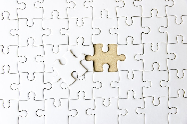 Fill the missing parts fragment of white jigsaw concept puzzle for succeed