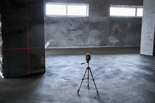 Filling the floor with concrete, screed and leveling the floor. Smooth floors made of a mixture of cement, industrial concreting