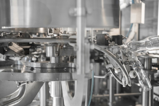 Filling milk in to plastic bottles at the factory equipment at the dairy plant