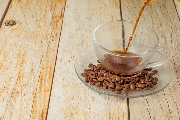 filling up a cup of coffee with freshly made coffee in traditional brazilian style