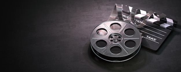 Film reel and clapper board on black background Movie video and cinema prodaction and edition concept