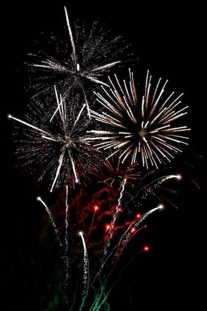 Finale fireworks with white flares over black