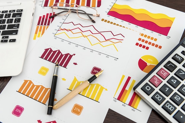 Financial accounting business chart or report with pen and calculator at office, Finance economy and investment