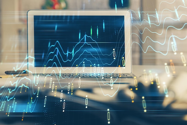 Financial chart drawing and table with computer on background Multi exposure Concept of international markets