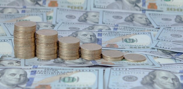 Financial concept image Histogram of coins against the background of dollars