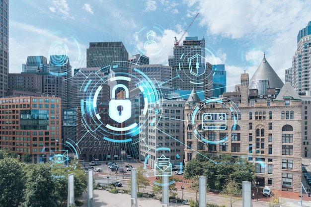 Financial downtown city view panorama of Boston from Harbour area at day time Massachusetts Glowing Padlock hologram The concept of cyber security to protect companies confidential information