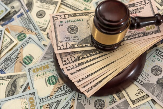 Financial judges gavel with dollars  corruption crimes