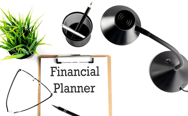 FINANCIAL PLANNER text on a clipboard on the white background