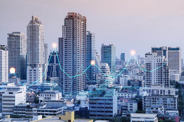 Financial stock chart hologram over panorama city view of Bangkok business center in Asia The concept of international transactions Double exposure