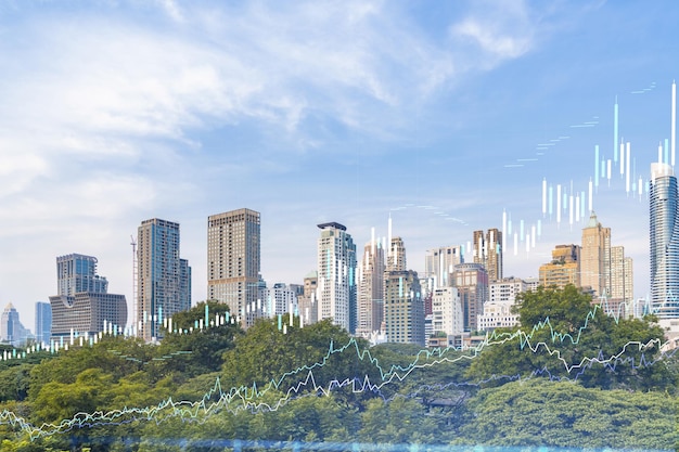 Financial stock chart hologram over panorama city view of Bangkok business center in Southeast Asia The concept of international transactions Double exposure