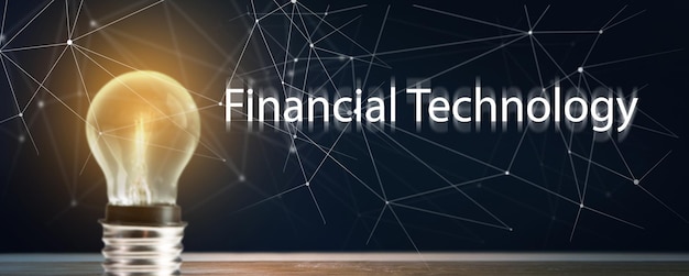 Financial technology and glowing light bulb