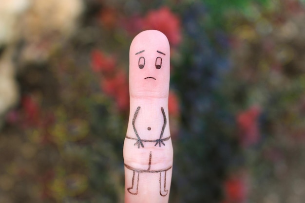 Finger art of sad man Concept of impotence