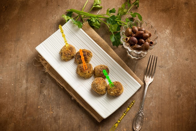 Finger food vegatarian meatballs with black olives