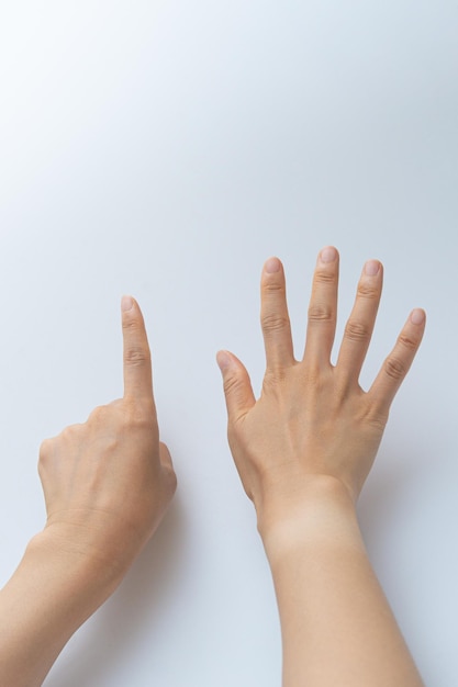 Finger gestures in various actions on a white background