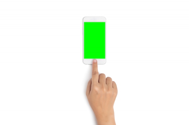 Finger touch on mobile phone button with blank green screen from top view with clipping path