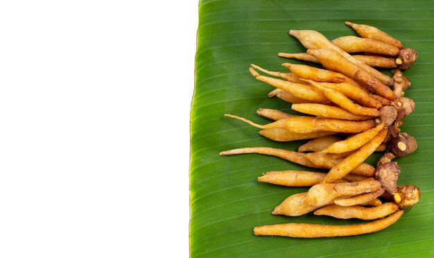 Fingerroot on banana leaves on white background.