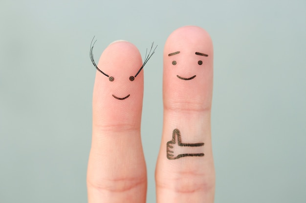 Fingers art of Happy couple. Man likes women's long eyelashes .