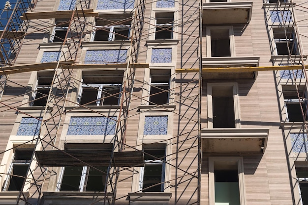 Finishing works on the facade of a new residential buildings