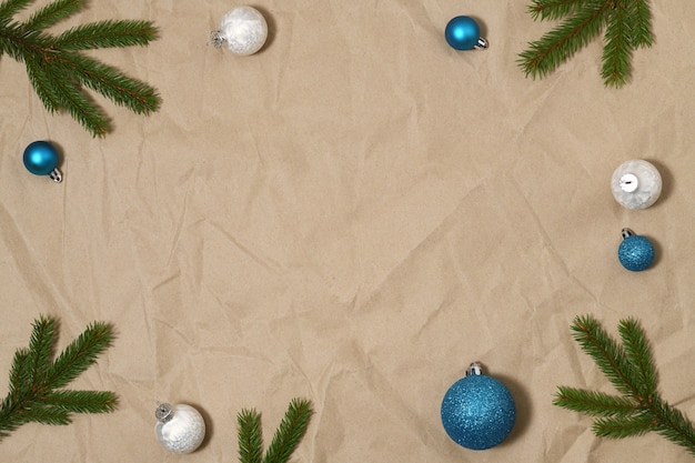 Fir branches with christmas ornament on paper background