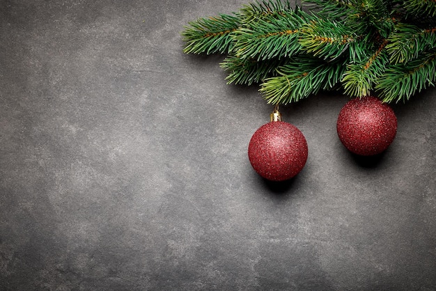 fir tree branch with red baubles