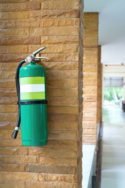 Fire extinguishers are mounted on the corridor walls.