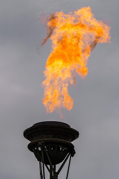 The fire of memory is lit on the rostral columns in St Petersburg Russia