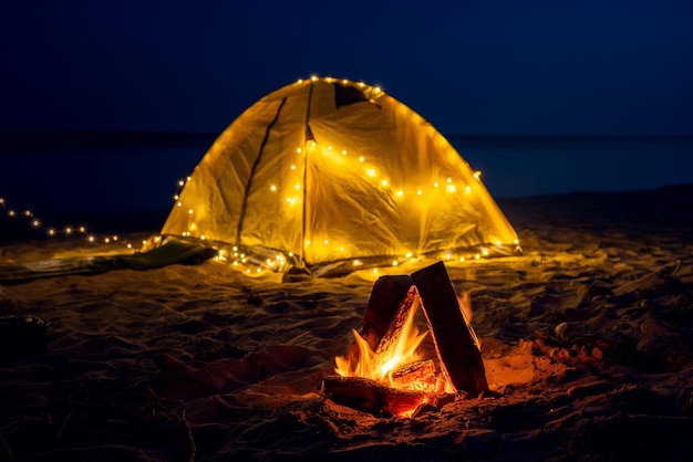 The fire at night on the beach Summer mood