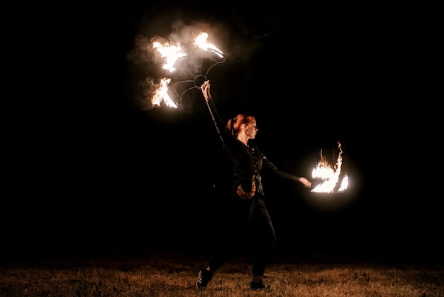 Fire show Fakir juggles with fire Poi Night performance Illusion of a suspended object