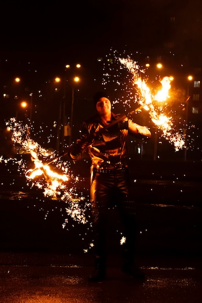 Fire show performance in the dark background