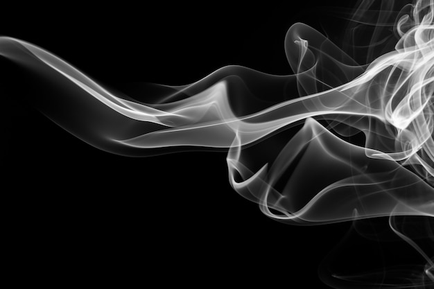 Fire of white smoke on black background. abstract movement