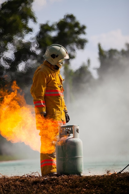 Firefighter with fire and suit for protect fire fighter for training firefighters