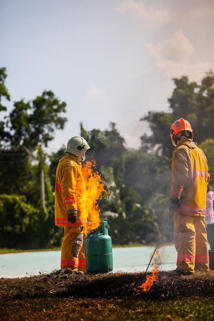 Firefighter with fire and suit for protect fire fighter for training firefighters