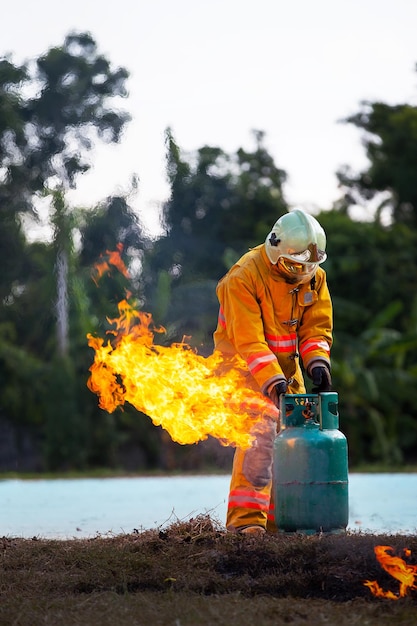 Firefighter with fire and suit for protect fire fighter for training firefighters