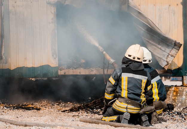 Fireman extinguishes fire