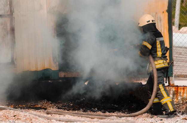 Fireman extinguishes fire