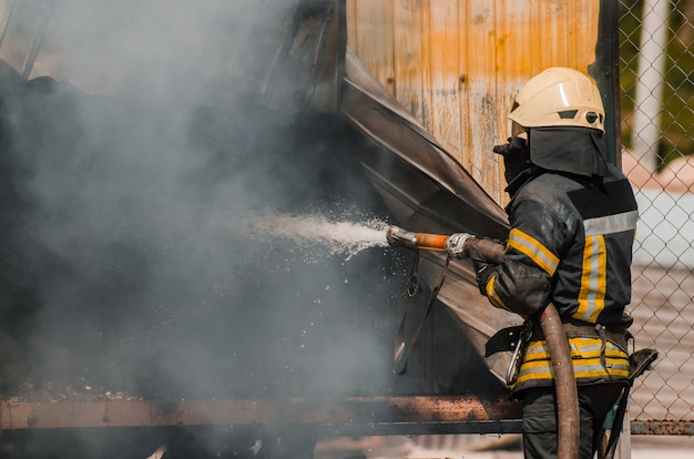 Fireman extinguishes fire