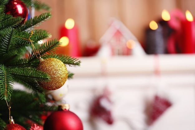 Fireplace with beautiful Christmas decorations in room