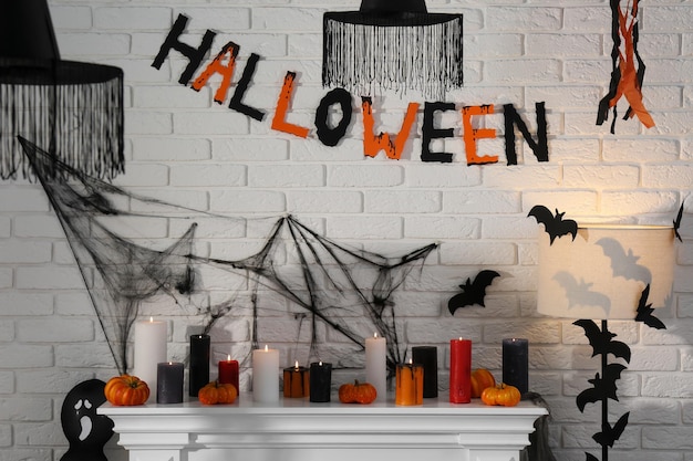 Fireplace with different Halloween decor indoors Festive interior