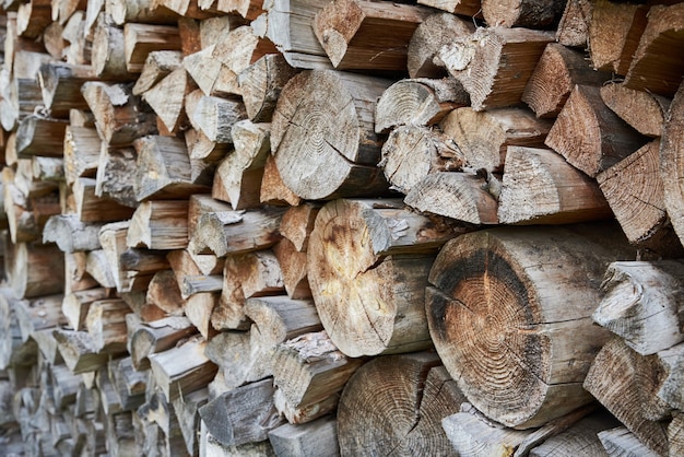 Firewood background. Preparation of firewood for winter season