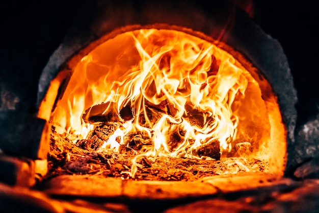 Firewood burning at the furnace close up